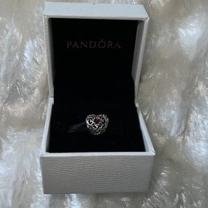 Retired Pandora ruby birthstone heart charm.